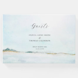 Elegante libro de Bodas acuáticos frente al mar