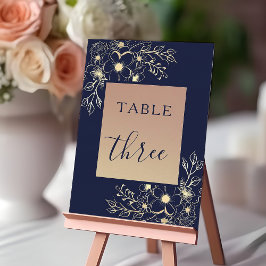 Elegante número de mesa de boda azul marino y dora