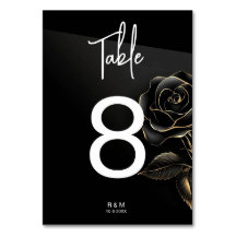 Elegante número de mesa de rosa negra y dorada