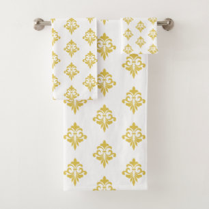 Elegante patrón de flor de lis dorada sobre blanco