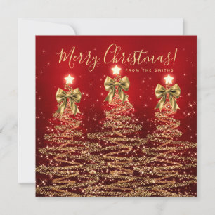 Elegante saludo de Navidad en oro y rojo de árbole