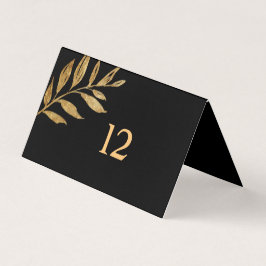 Elegante tarjeta de mesa de hojas de oro y negro