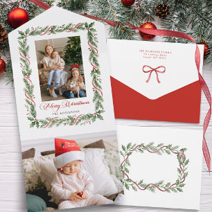 Elegante tarjeta de Navidad con vegetación y cinta