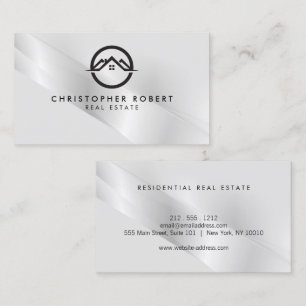 Elegante tarjeta de negocios inmobiliaria plateada