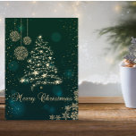 Elegante verde, falso árbol de Navidad de oro, cop<br><div class="desc">Elegante árbol de Navidad de oro falso,  bolas y copos de nieve sobre fondo verde hacen de esto un Navidad perfecto o tarjeta de saludo de vacaciones para amigos y familia.</div>