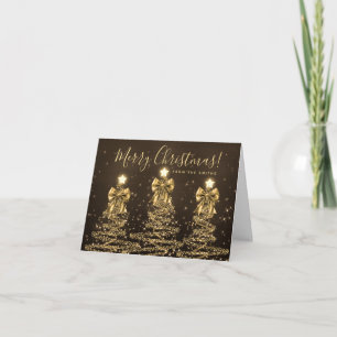 Elegantes árboles de Navidad dorados de vacaciones