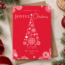 Elegantes copos de nieve en árbol de Navidad rojo
