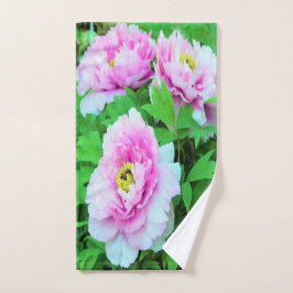 Elegantes flores de peón rosado con centro amarill