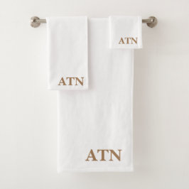 Elegantes iniciales en fondo blanco marrón de caca