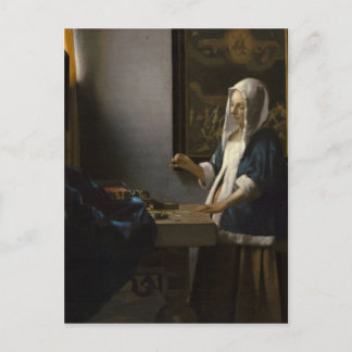 Enero Vermeer, mujer que sostiene una postal de la