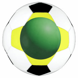 Esfera verde sobre balón de fútbol amarillo