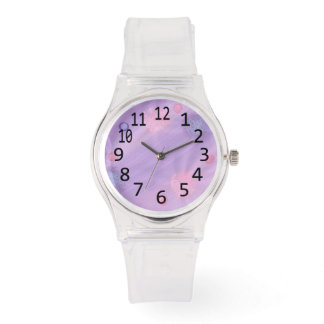 Esferas rosadas y de lavanda en relojes numerados