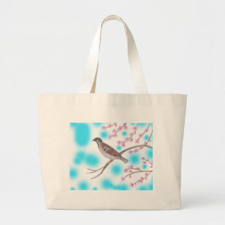 Esparrow en las bolsas de té del árbol de flores d