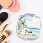 Espejo Compacto Boda en la playa de Bridesmaid<br><div class="desc">Una playa tropical,  con olas y palmeras,  de color acuático. Personalice y agregue el nombre de su dama de honor. Guión de estilo manuscrito negro.</div>