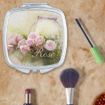Espejo Compacto Canasta de Rosas<br><div class="desc">Una canasta llena de rosas,  ¿qué más podría querer alguien? Mejor aún,  esto no desencadenará ninguna alergia. Se puede cambiar el Rosa a su nombre o dejarlo como está.</div>