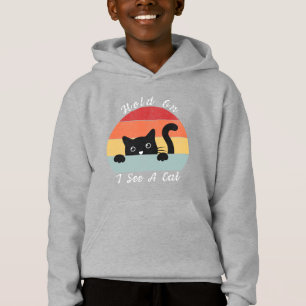 Espera, veo una mirada de gato, juguetón y humorís
