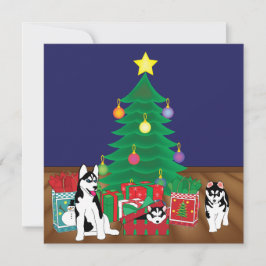 Esposos jugando bajo la carta del árbol de Navidad