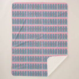 Esquí azul sobre manta rosa