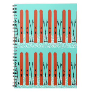 Esquíes rojos en cuaderno azul