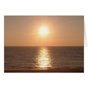 Establecer el sol y la costa