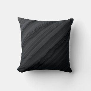 Este es un cojín de almohada para rayas negras.