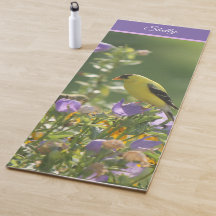 Goldfinch en una flor harebell