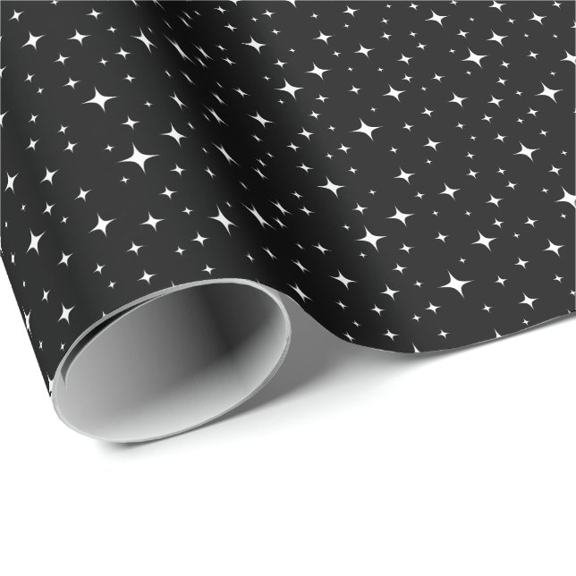 Estrellas blancas sobre papel de envoltura en el c (Esquina del rollo)