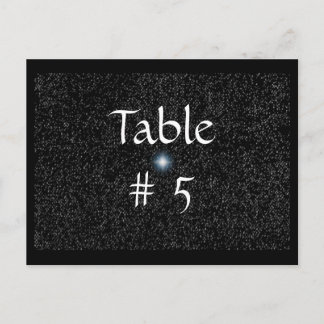 Estrellas plateadas en tarjetas postales con númer