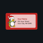 Etiqueta Christmas penguin walking on snow<br><div class="desc">A little penguin cartoon with santa hat and green scarf walking on snow.</div>