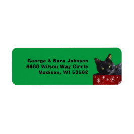 Etiqueta de dirección de gato negro sobre copos de