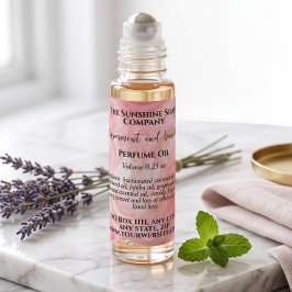 Etiqueta de frasco de perfume rosa y dorado delica