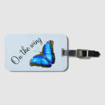 Etiqueta de maletas con mariposa azul "Al ala"