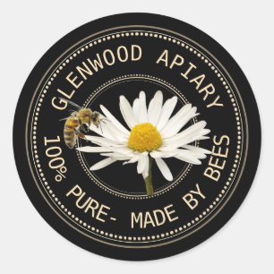 Etiqueta de miel con abejas y margarita en negro