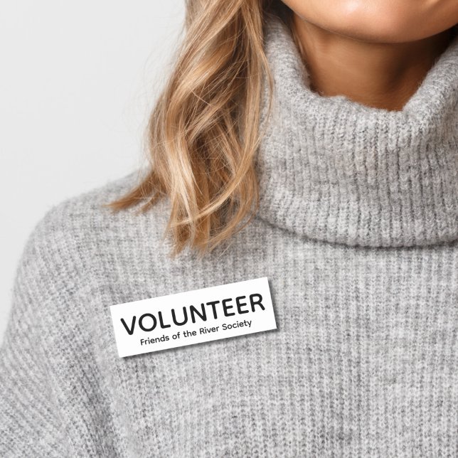 Etiqueta de nombre de placa de voluntario clásico  (Woman in gray sweater wearing this customizable volunteer name tag badge in black and white.)