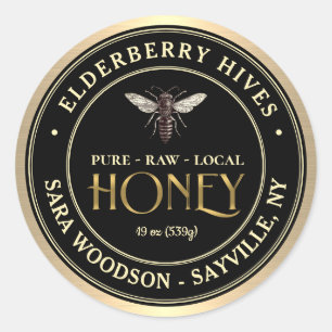 Etiqueta de oro y miel negra con abeja reina vinta