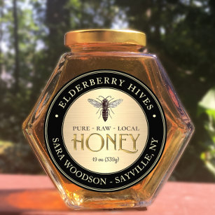 Etiqueta de oro y miel negra con abeja reina vinta