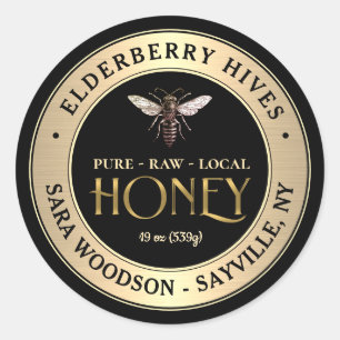 Etiqueta de oro y miel negra con abeja reina vinta