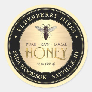 Etiqueta de oro y miel negra con abeja reina vinta