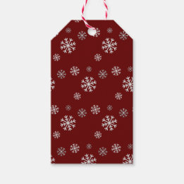 Etiqueta de regalo de Navidad con nieve en rojo in