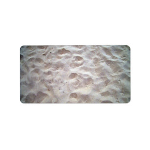 Etiqueta Huellas sobre la textura de arena