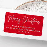 Etiqueta Merry Christmas script red return address<br><div class="desc">Los Navidades rojos devuelven las etiquetas de dirección con el texto blanco "Feliz Navidad" en un tipo de letra manuscrito y su nombre y dirección de retorno a continuación.</div>