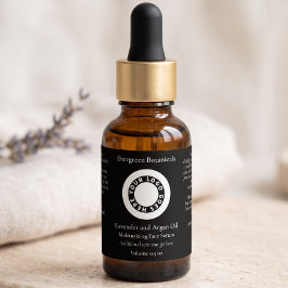 Etiqueta negra de botella de gotero de cosméticos