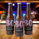Etiqueta Para Botella De Cerveza Hello 60! - 60th Birthday Woman with Pink Glitter<br><div class="desc">Hello 60! Invite your friends and family to celebrate the 60th birthday with this modern design. The design features a black background, the numbers thirty in faux pink glitter, with an elegant pink glitter background, elegant calligraphy script, a modern birthday template that's easy to personalize, Don't think about it and...</div>