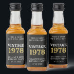 Etiqueta Para Botella De Licor Funny Vintage 50th Birthday Black<br><div class="desc">Graciosas etiquetas de botellas de licor negro y oro para sus favores de cumpleaños número 50. Personaliza "Toma un tiro que aún está caliente" y "Vintage" si lo deseas,  el año en que nació,  su nombre y la fecha.</div>