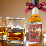 Etiqueta Para Botella De Licor Holly and Pine Merry Christmas Gold Frame Photo Mi<br><div class="desc">Estas etiquetas de botellas de licor son excelentes para regalar el espíritu esta temporada de vacaciones. El diseño de acuarela pintado a mano presenta su foto en un marco de Relieve metalizado falso dorado rodeado de hojas verdes y huecas, ramas de pino, pinecones y brotes de bayas rojas. La leyenda...</div>