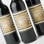Etiqueta Para Botella De Vino Gold Merry Christmas Black White Strips<br><div class="desc">Feliz Navidad con letras blancas de moda sobre un toque de Relieve metalizado de oro falso, estas etiquetas de botellas de vino tienen un fondo de modernas gafas de oro sobre rayas negras y blancas y puntos dorados. Personalizado con tu nombre. MÁS diseños en nuestra tienda, placas de papel, servilletas...</div>