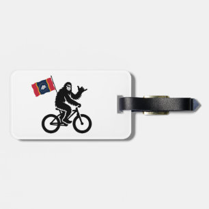 Etiqueta Para Maletas Bigfoot en bicicleta con la bandera de Mississippi