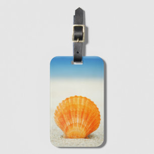Etiqueta Para Maletas Cubierta De Vieiras Naranja En Arena