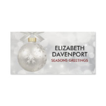 Elegantes Navidades plateados bailan sobre las luc