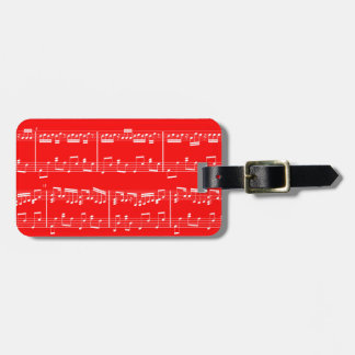 Etiqueta roja del equipaje de la partitura